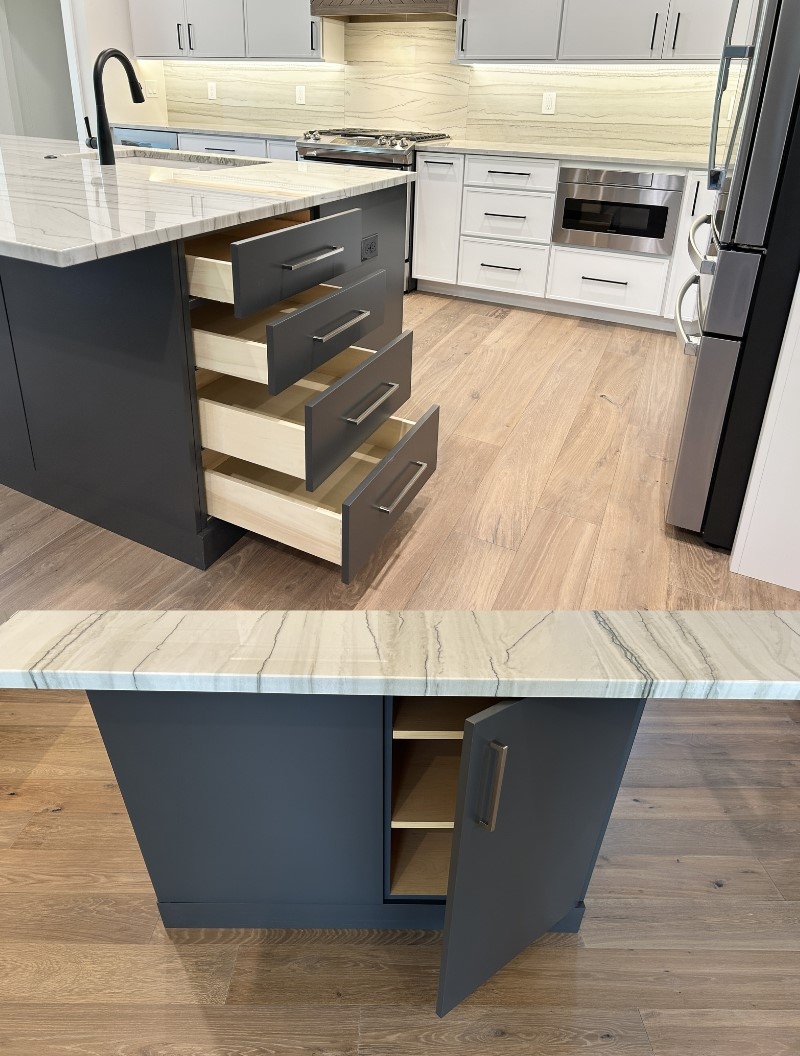 dark pewter painted kitchen island full height cabinets open to show storage at the ends of kitchen island design