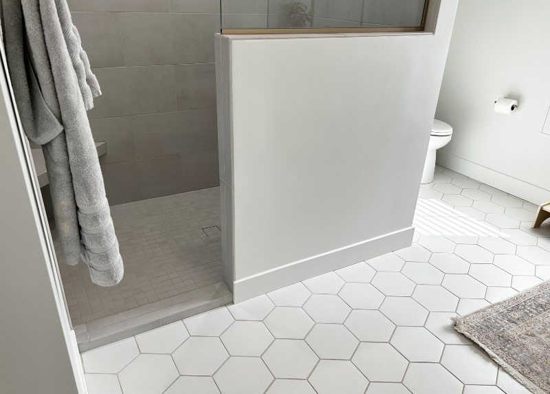beehive hex floor tile with medium brown grout