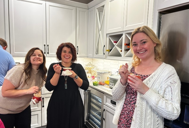 women at work soup cookoff with sample bowls