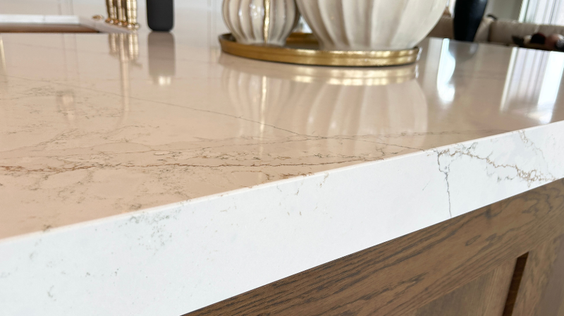 closeup image of mitered edge thick quartz countertops in calacatta viraldi MSI q quartz 