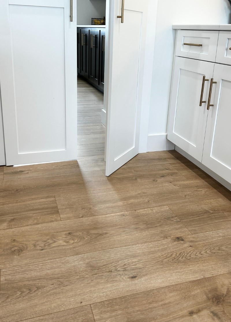  vinyl plank flooring shown in kitchen and looking into walk in pantry area