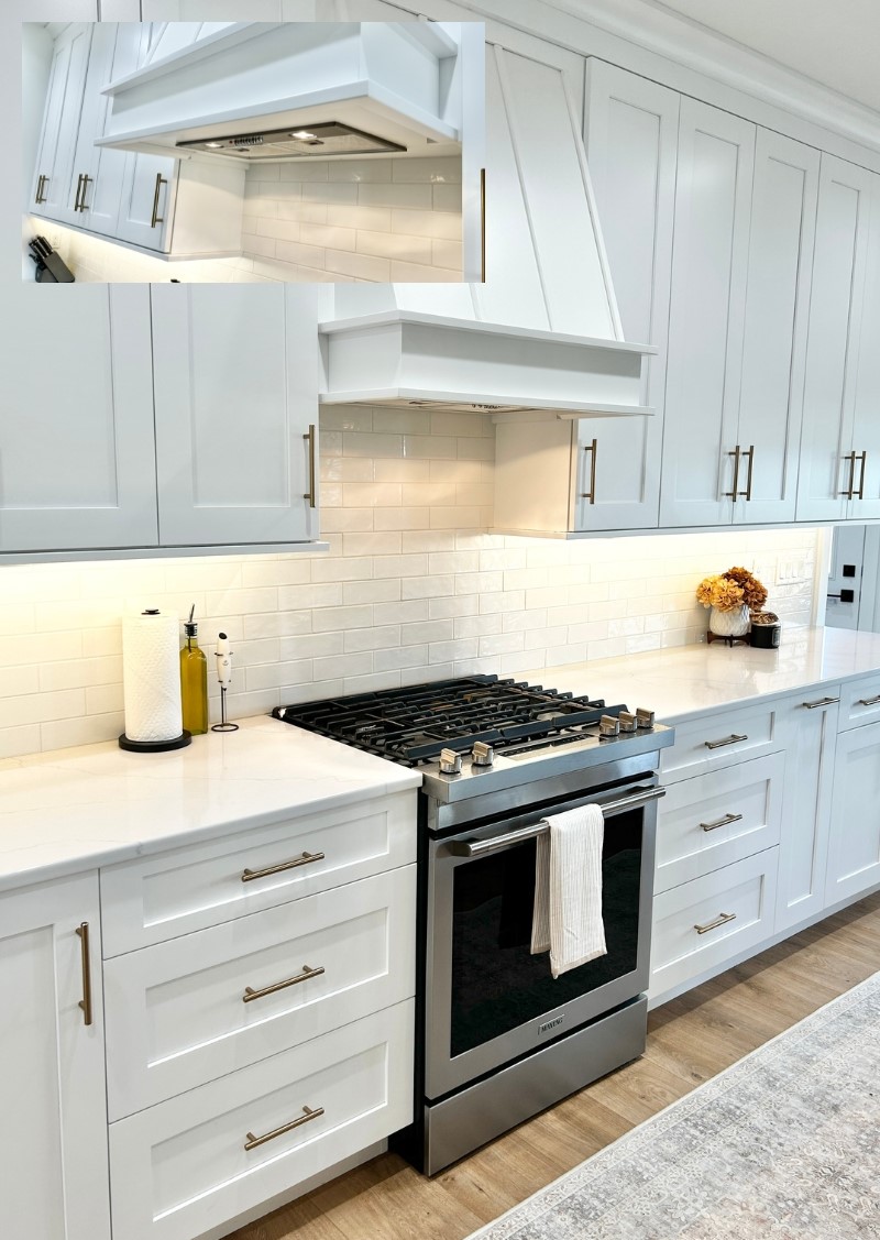 kitchen range with decorative painted wood range hood cabinet above and stainless steel insert shown in inset image