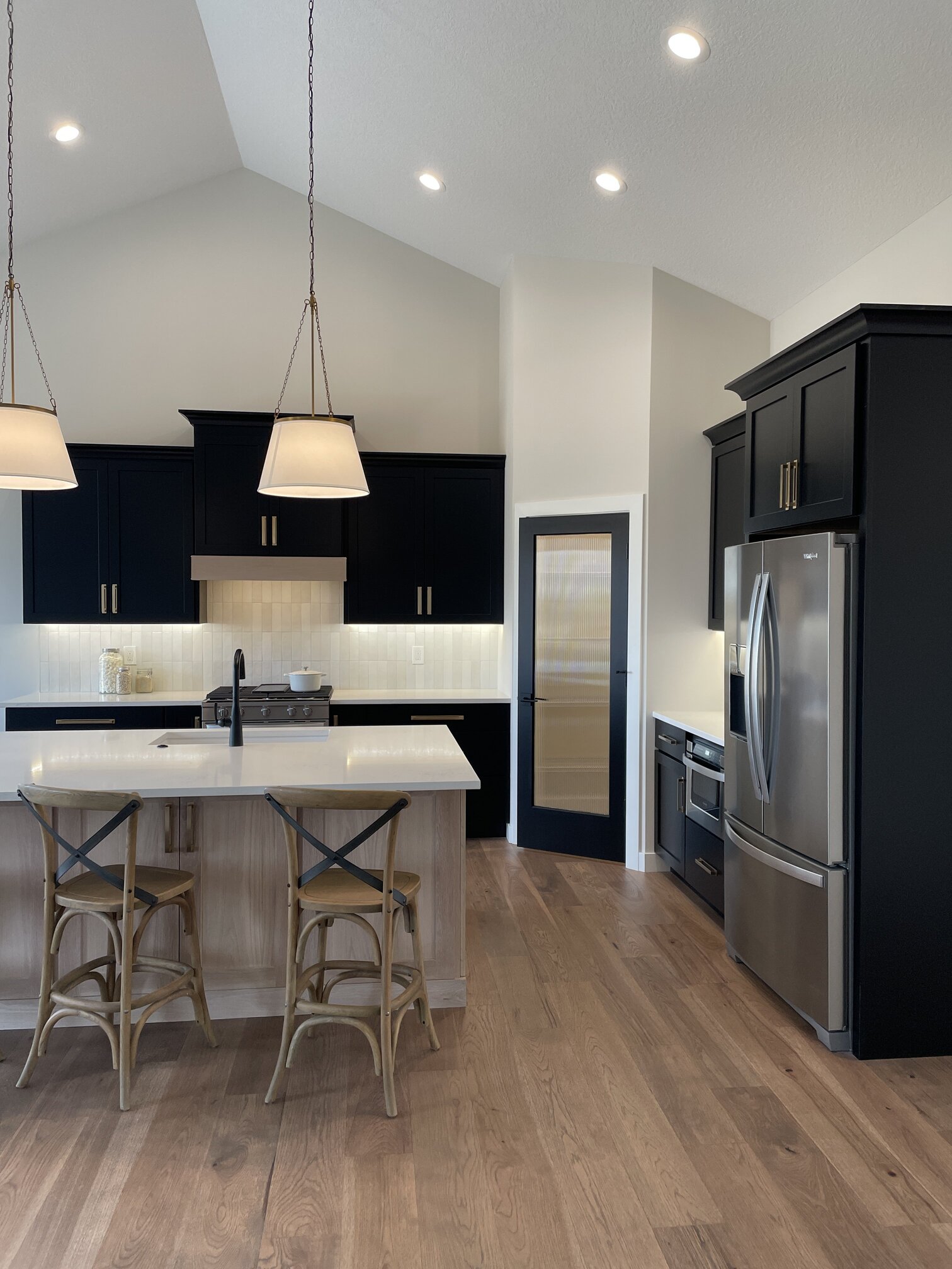new home kitchen design with island and corner pantry 