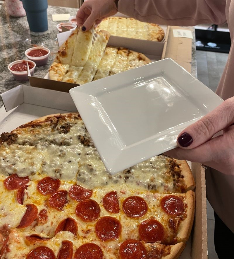 la roma pizza Geneseo Illinois being plated up
