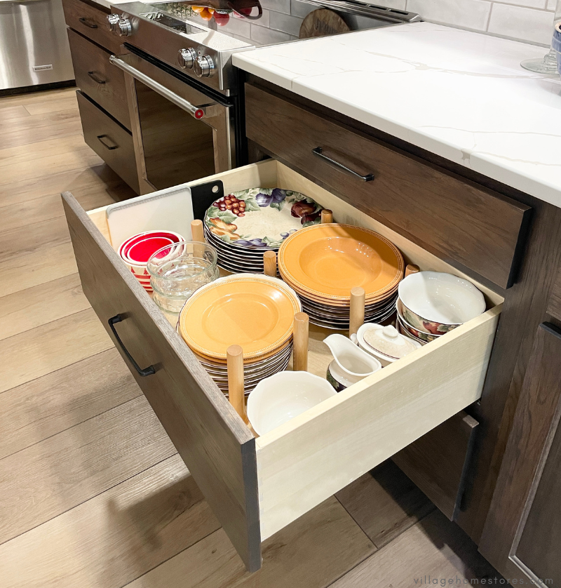 kitchen cabinet with open pegboard drawer organizer