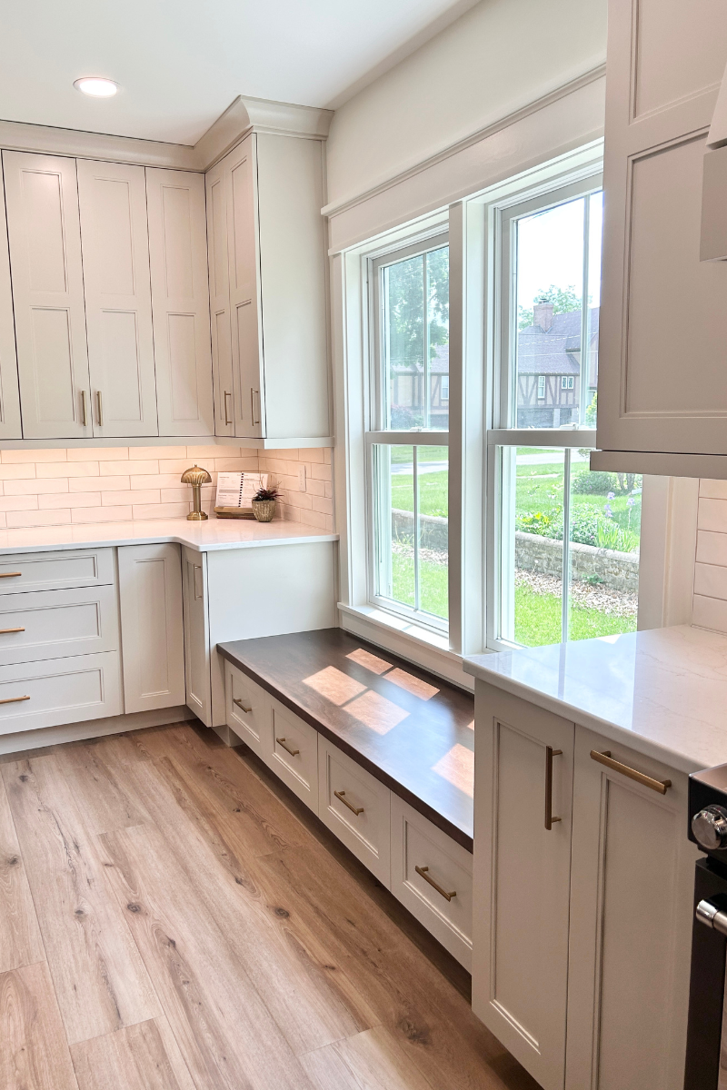 custom cabinet bench seat under low window in kitchen