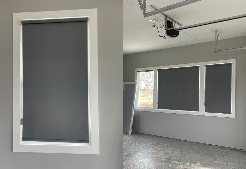 grey roller shades installed over garage windows