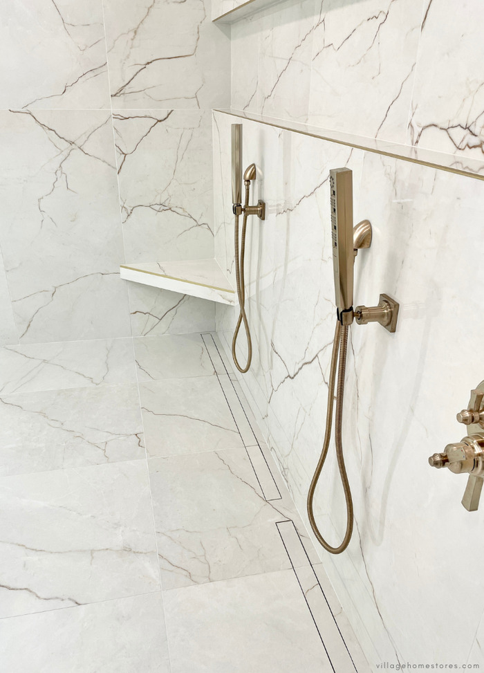 corner tile shower shelf with gold edge pieces