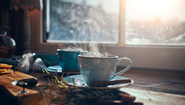 Hot tea sitting by windowsill