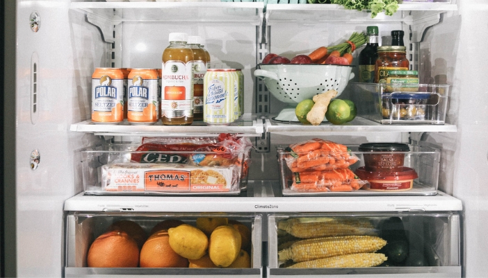 interior of fridge stocked with food