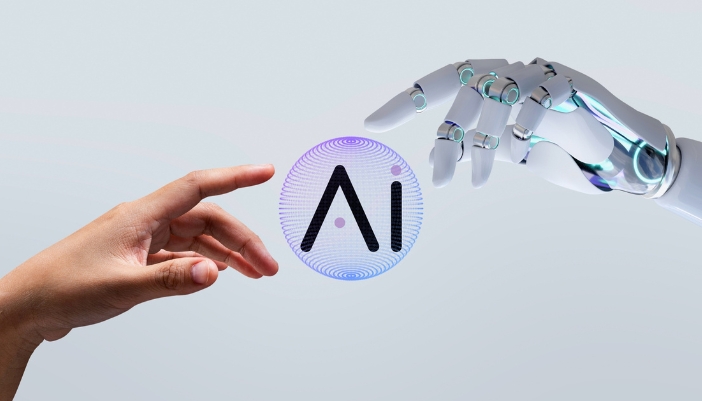 A robot hand reaches out for a human hand with a gray background.