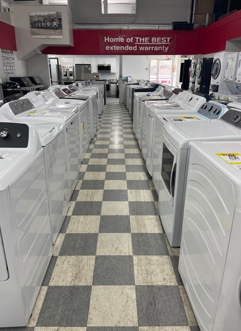 Interior shot of a row of washing machine on a salesfloor.