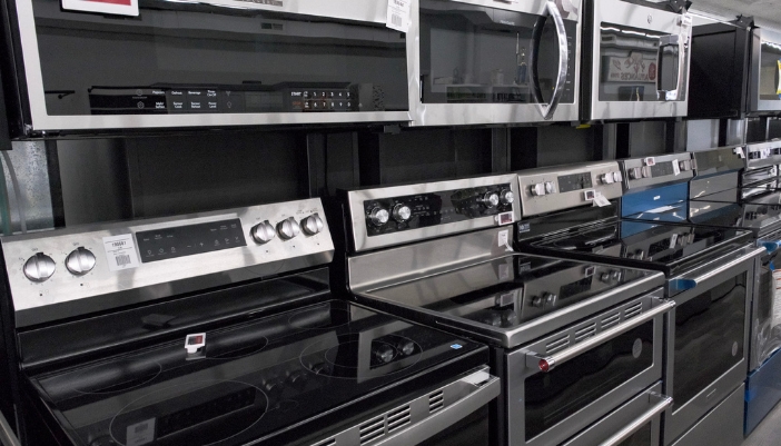 A selection of electric ranges in a showroom