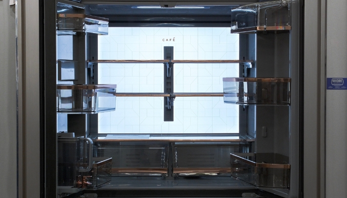 A closeup of the interior of a Cafe refrigerator.