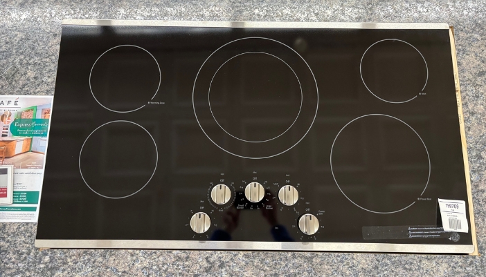 A close-up of a cooktop in a showroom.