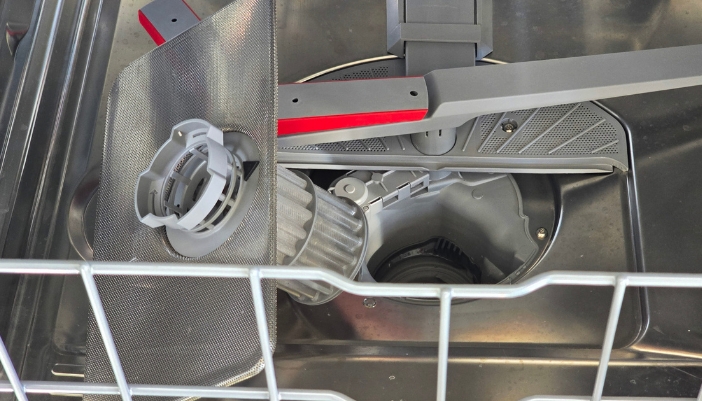 A closeup of a dishwasher filter.