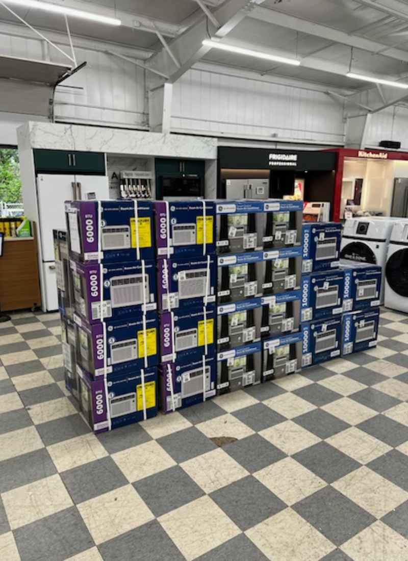 A stack of boxed air conditioners.