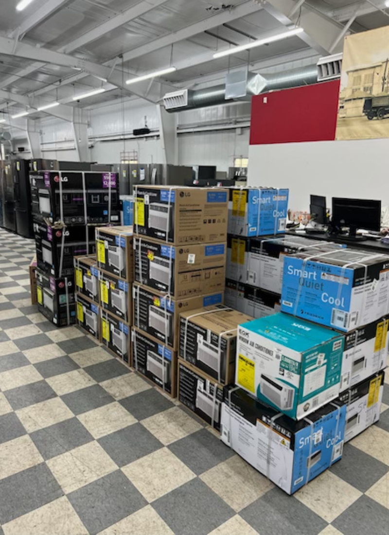 A stack of boxed air conditioners.