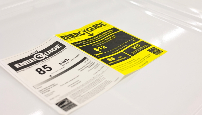 An open Energy Guide from a home appliance lays on a counter.