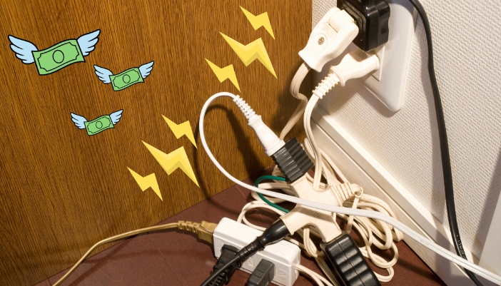 An overloaded extension code with electricity symbols and dollar signs flying off it.