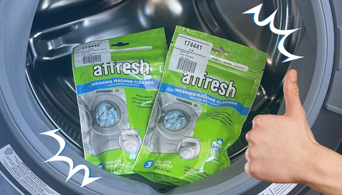 A set of Affresh washing machine pods in a washer and a thumbs up to the side.