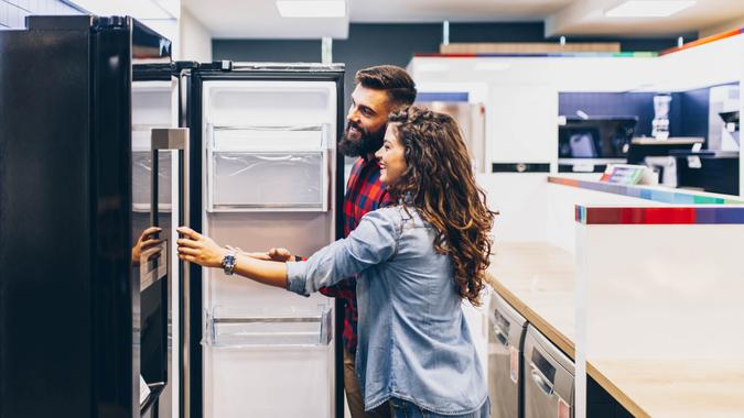 Two people appliance shopping