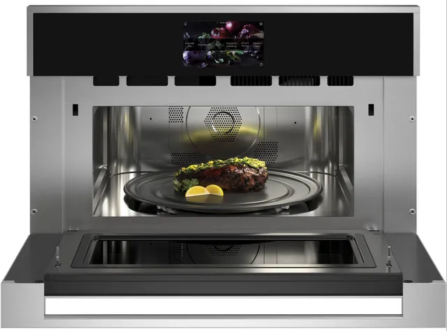 A steak cooking inside the Monogram ZSB9131NSS speed oven 
