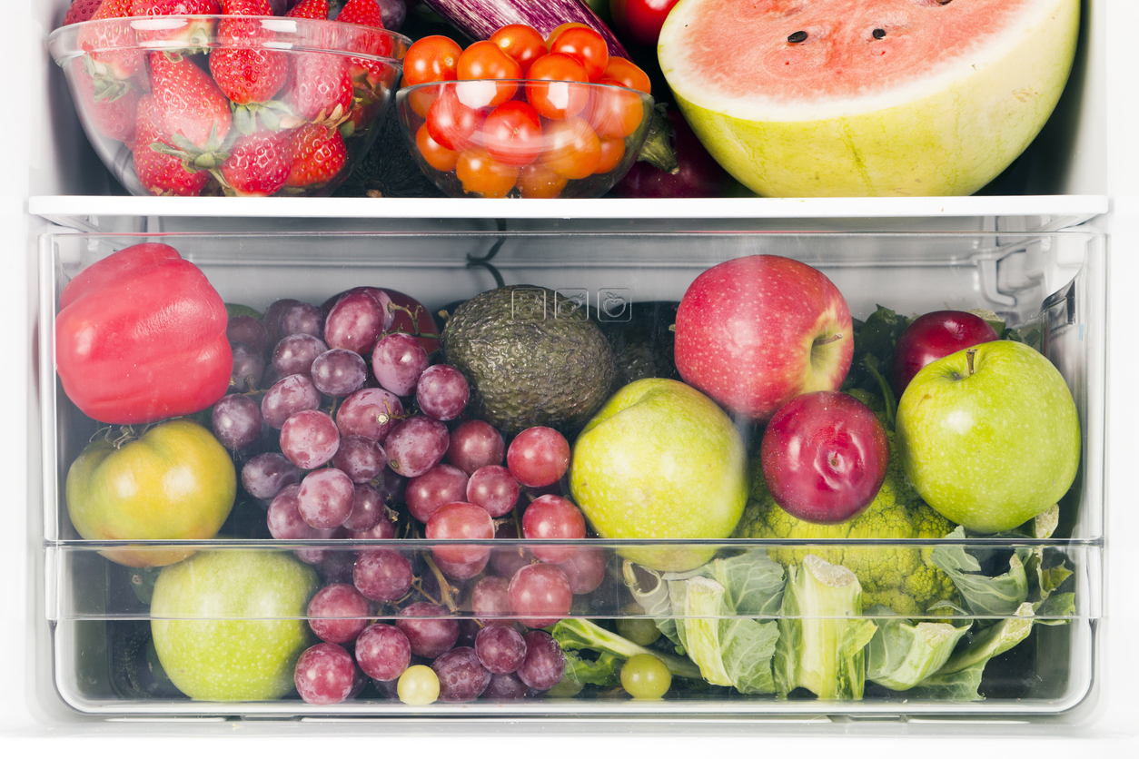 an assortment of vegetables and fruit in refrigerator drawers