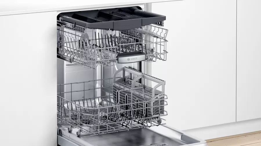 Bosch SHP865ZDN dishwasher fully opened with racks pulled out