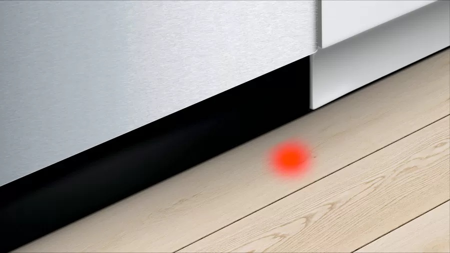 Up close look at InfoLight floor beam on Bosch SHP865ZDN dishwasher