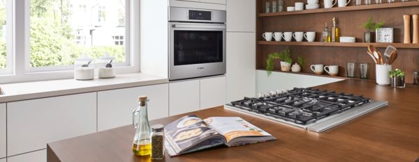 Modern wooden kitchen with Bosch cooking appliances