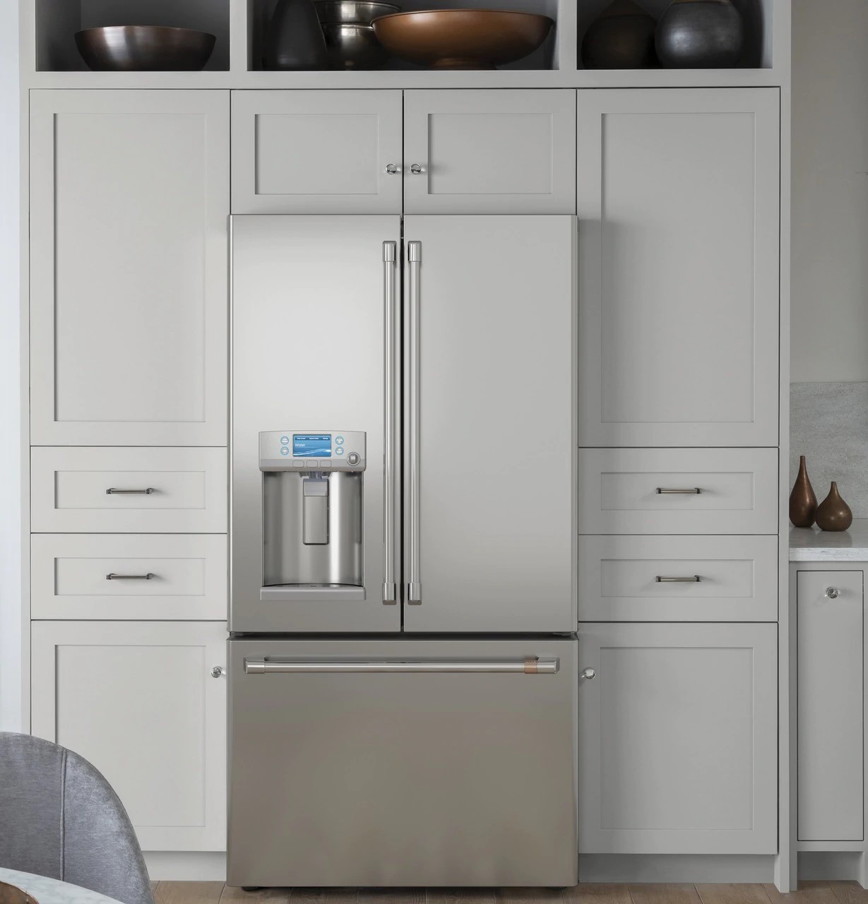 café CYE22TP2MS1 French door refrigerator inside a modern kitchen