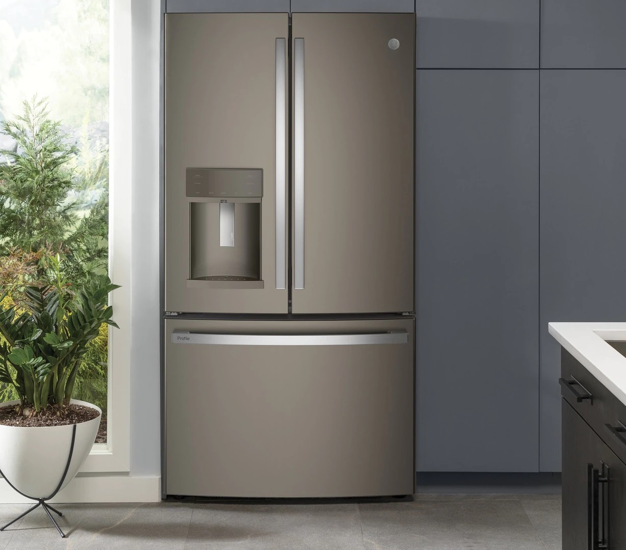 GE Profile PFE28KMKES refrigerator in updated kitchen