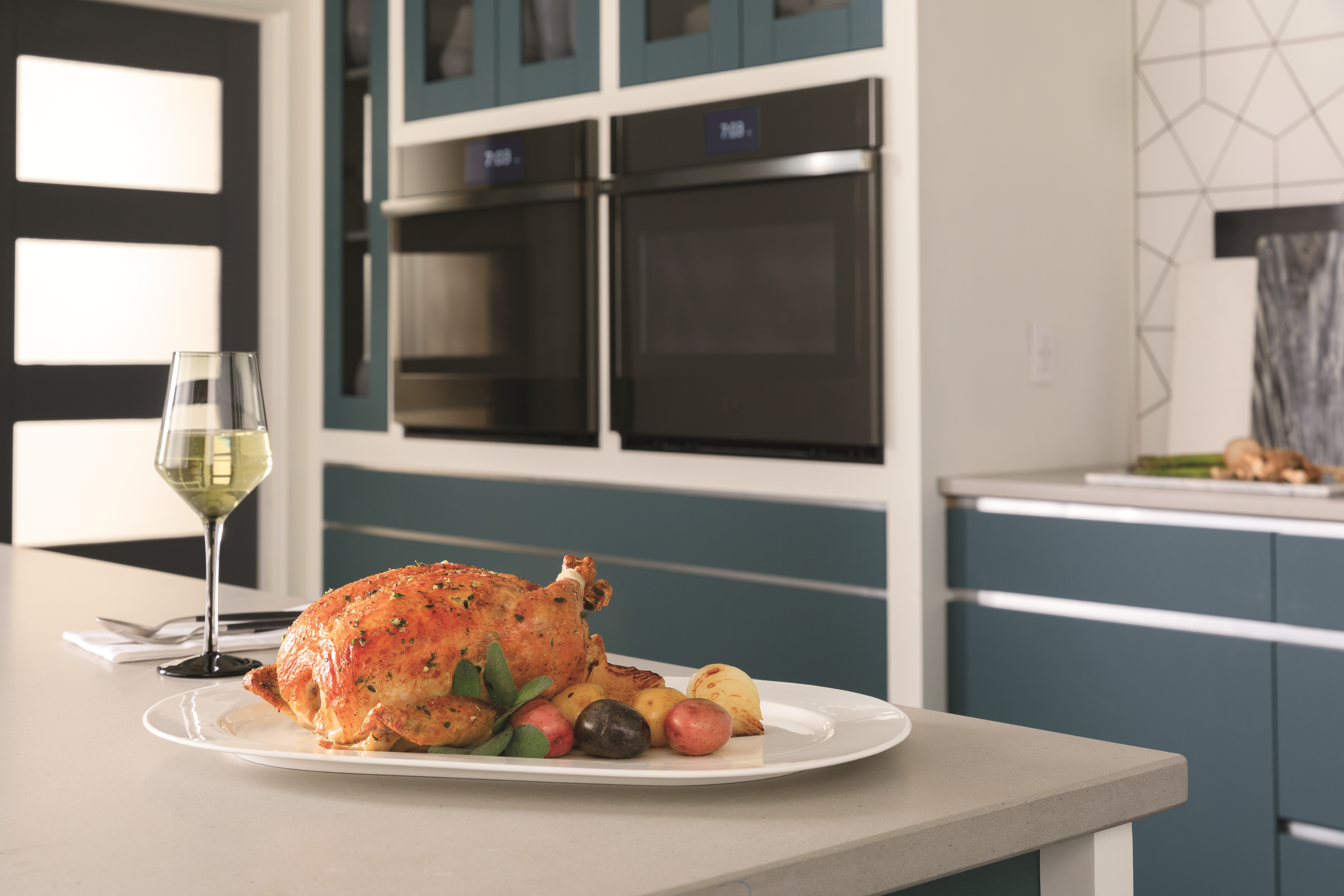 Roast chicken staged in front of GE Profile wall oven