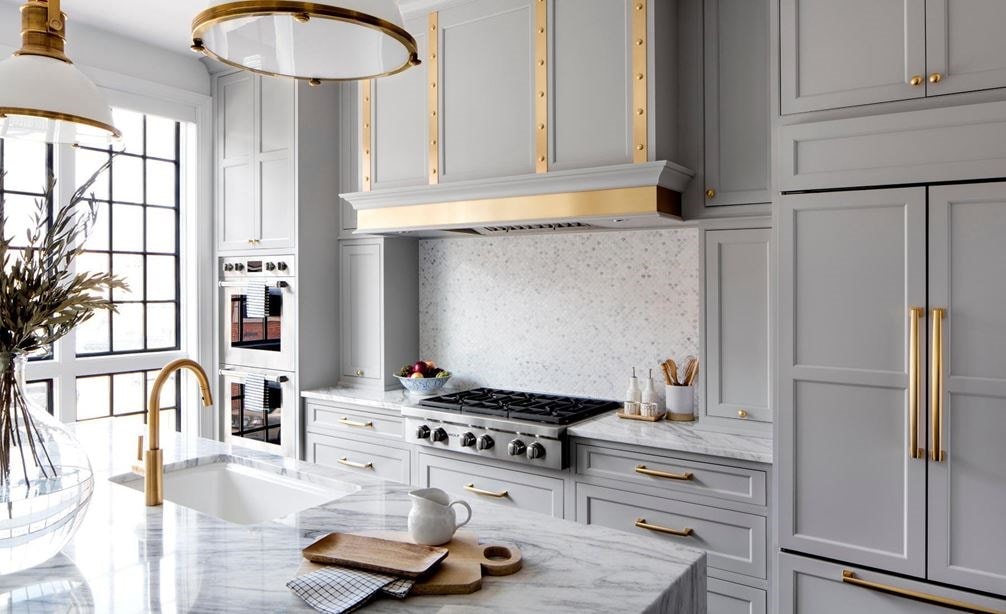 Credit: Hammel Interiors Long shot of Wolf rangetop, ventilation, and double wall oven, and Sub-Zero refrigerator in Baltimore Row kitchen design by Bria Hammel