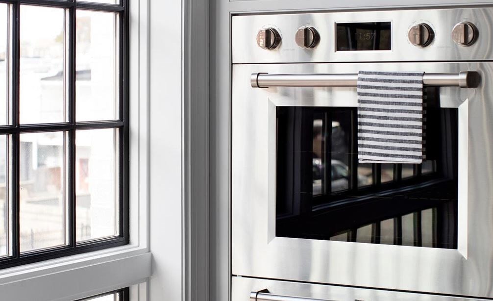 Credit: Hammel Interiors Up close look at Wolf M Series double wall oven in Baltimore Row kitchen design by Bria Hammel