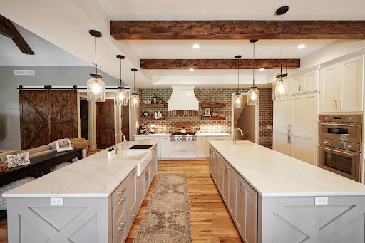 Wide view of JFK Design Build Double Island Kitchen featuring Thermador appliances
