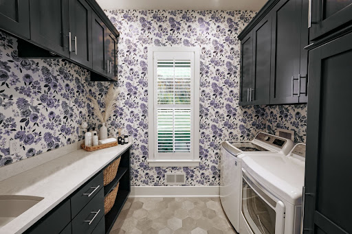 JFK Deign Build’s Delafield floral laundry room featuring an LG top load washer and dryer pair 