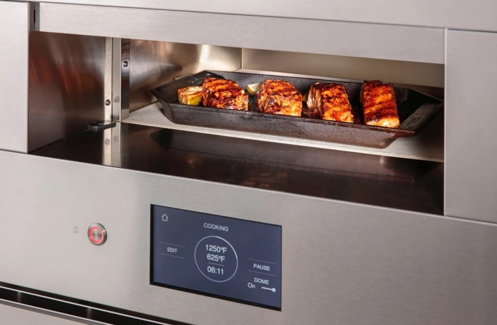 Monogram ZEP30FRSS 30” Smart Hearth Oven shown with salmon baking on a cast iron tray 