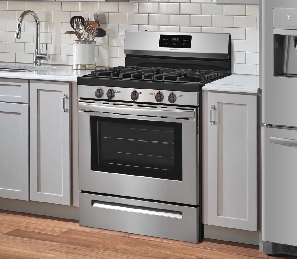 Modern kitchen featuring a Frigidaire FFGF3054TS gas range 