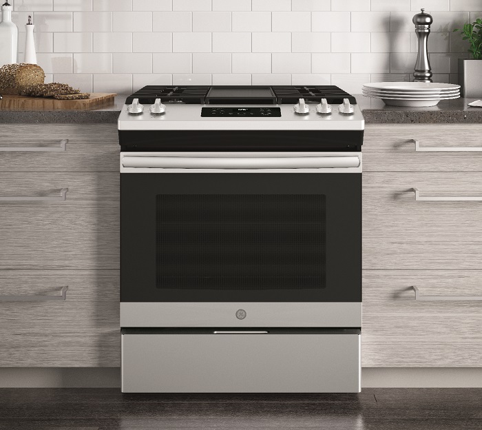 Wide shot of kitchen featuring GE jgss66selss gas range 