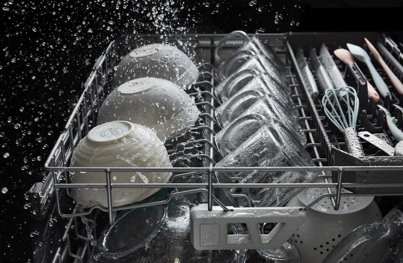 Action shot of wash cycle inside a Whirlpool WDT750SAKZ dishwasher