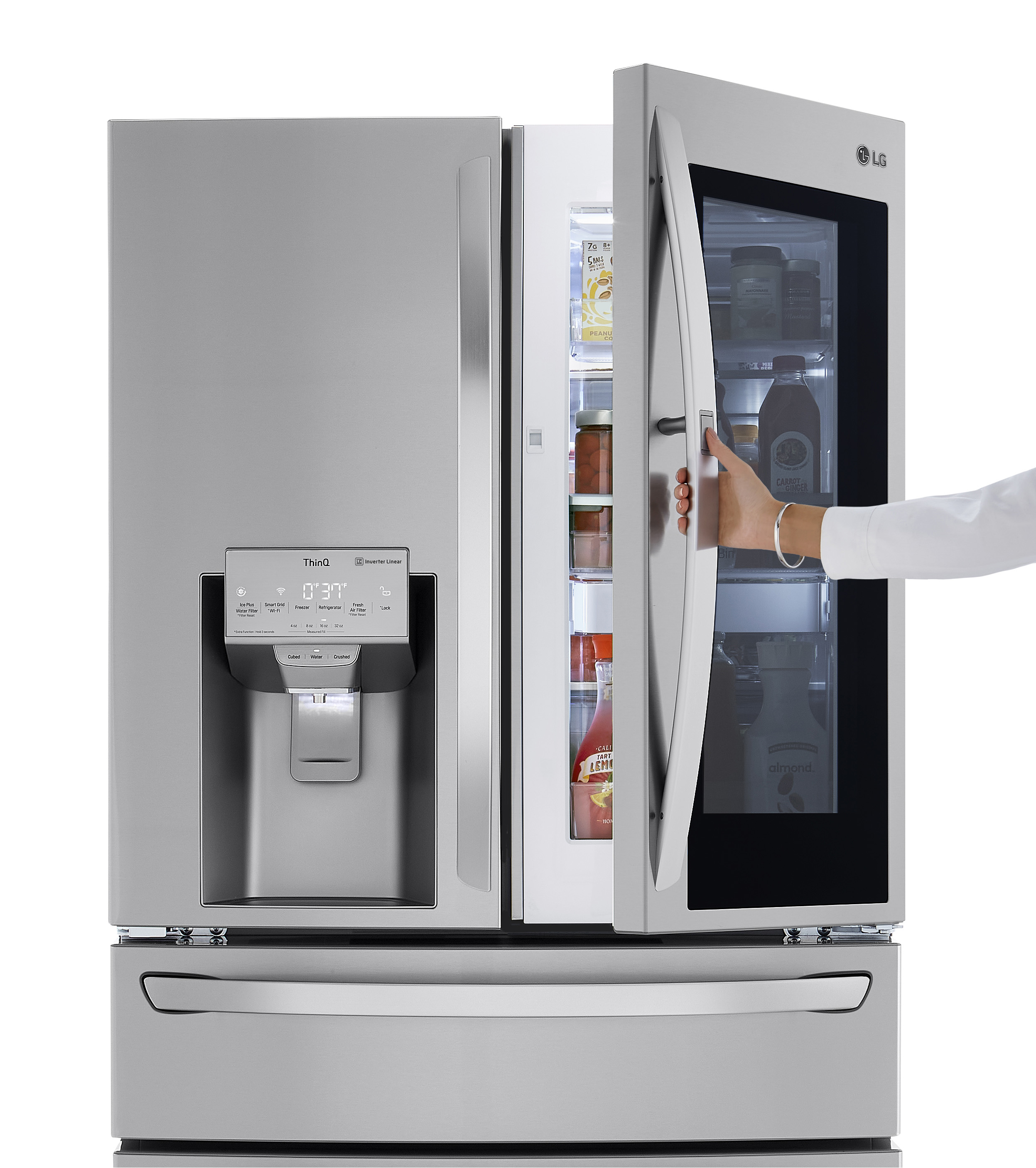 woman using the InstaView Door-in-Door feature on LG LRMVC2306S refrigerator