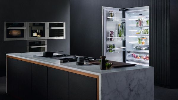 A kitchen featuring a Miele built-in refrigerator and ovens