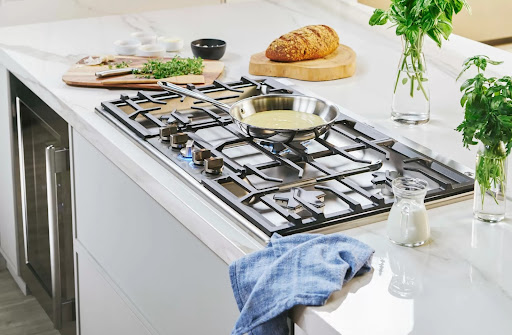 Lifestyle image of Thermador gas cooktop with saucepan