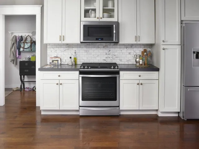 Shot of Whirlpool WEG745H0FS slide in gas range installed in kitchen 