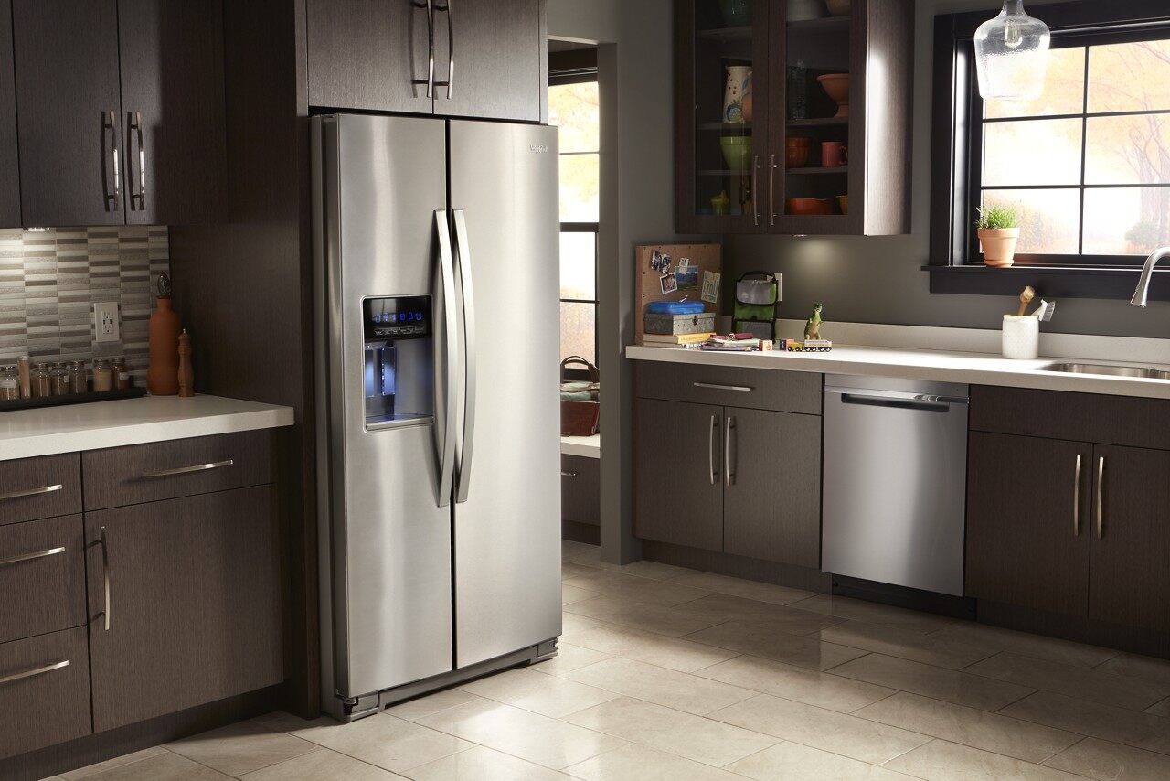 stainless steel side by side refrigerator in kitchen