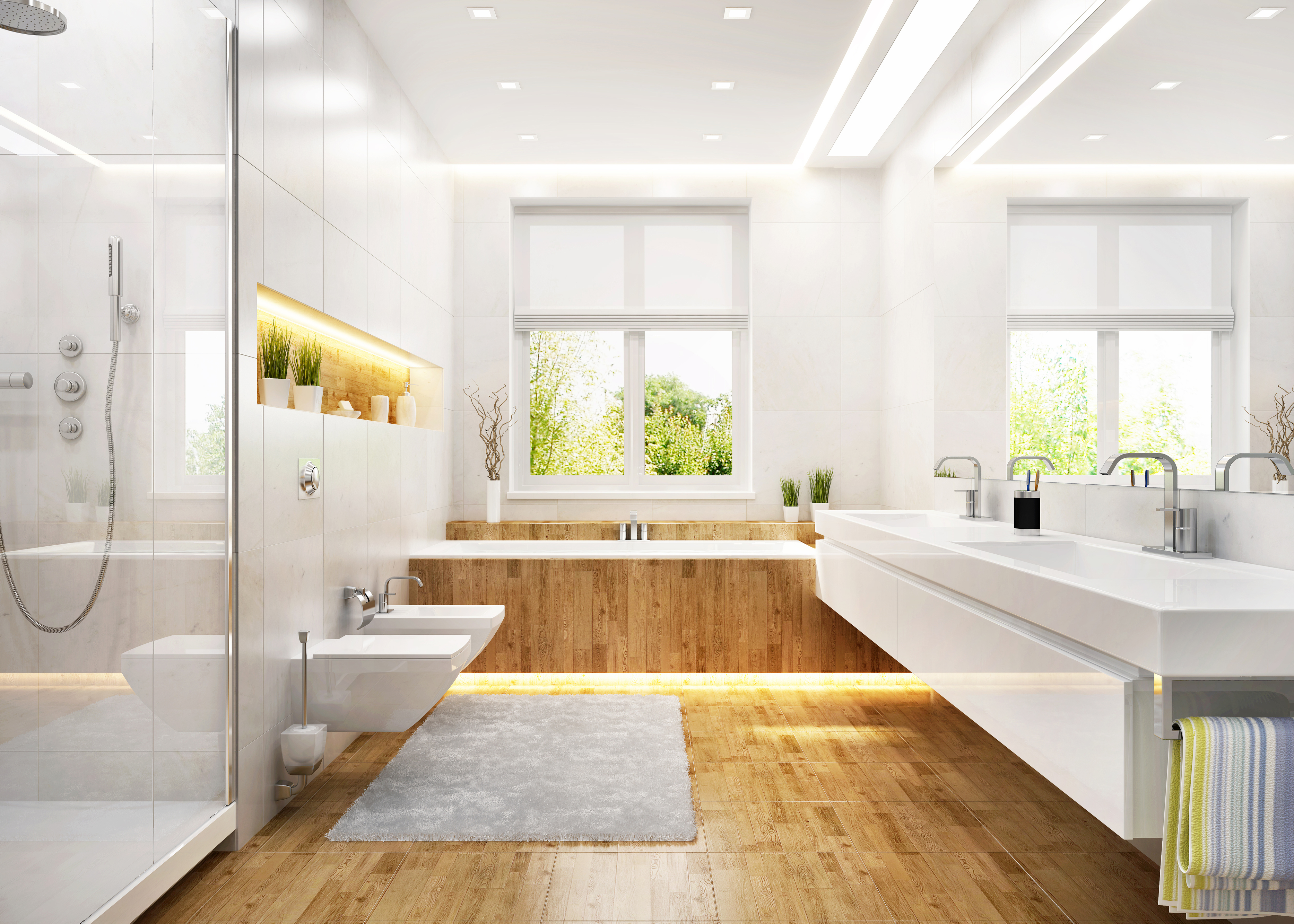 A modern bedroom with white fixtures and wooden floors