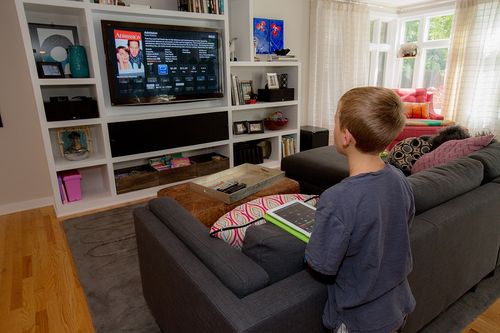 Child Changing Channel on TV
