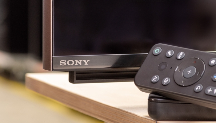 A closeup of a Sony logo and a streaming remote.